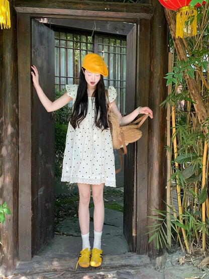 Super beautiful polka dot strappy short dress for women summer 2025 new loose slim French style short skirt with small flying sleeves