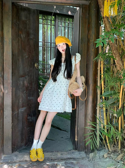 Super beautiful polka dot strappy short dress for women summer 2025 new loose slim French style short skirt with small flying sleeves