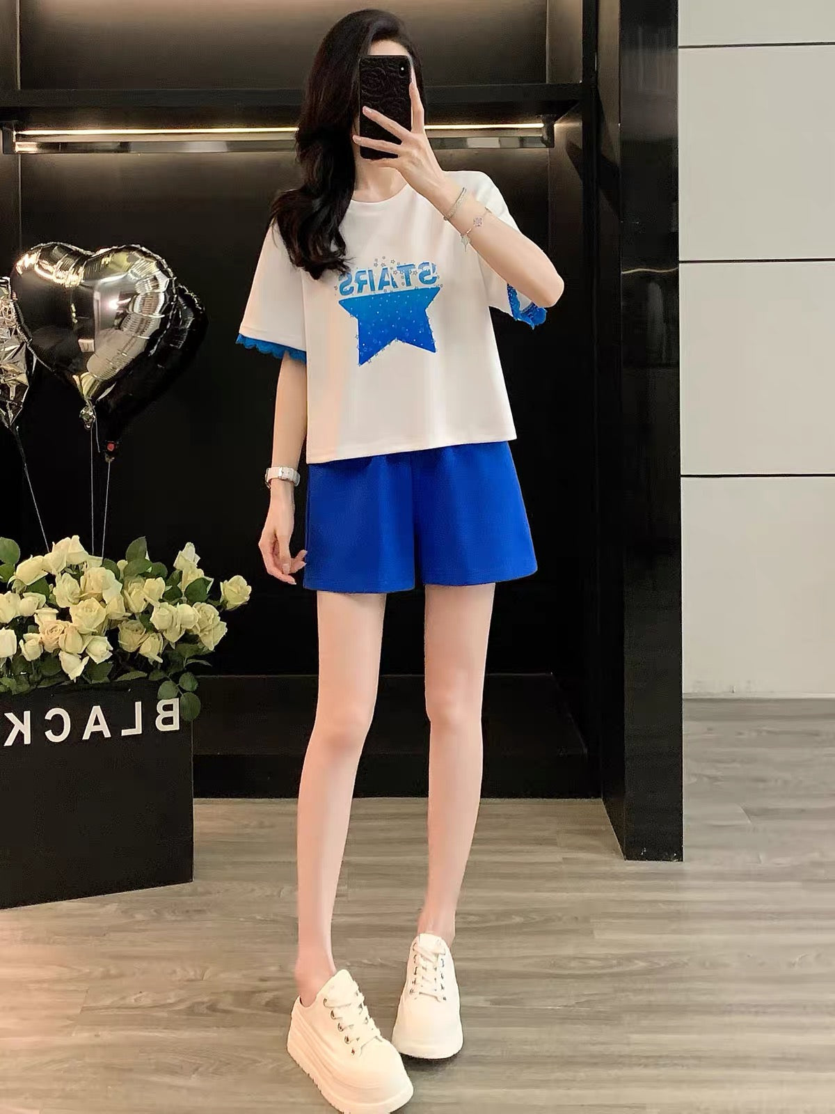 Trendy Hong Kong-style women's summer short-sleeve and shorts two-piece set; loose, casual, and sporty; youthful and slimming.