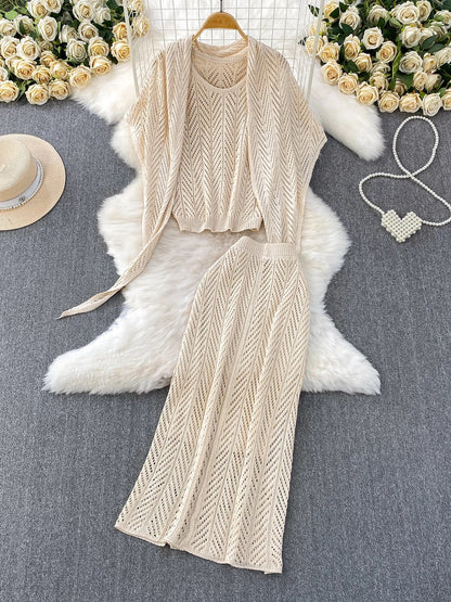 Resort-style breathable openwork knit vest top + elegant shawl with tie + high-waisted slimming skirt three-piece set