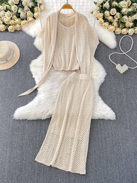 Resort-style breathable openwork knit vest top + elegant shawl with tie + high-waisted slimming skirt three-piece set