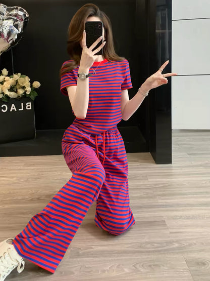 Stylish, youthful, and chic women's summer two-piece athleisure set featuring a striped short-sleeve top and wide-leg trousers—casual and slimming.