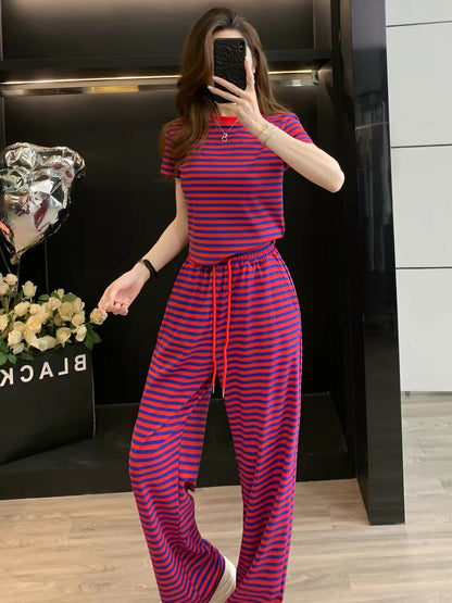 Stylish, youthful, and chic women's summer two-piece athleisure set featuring a striped short-sleeve top and wide-leg trousers—casual and slimming.