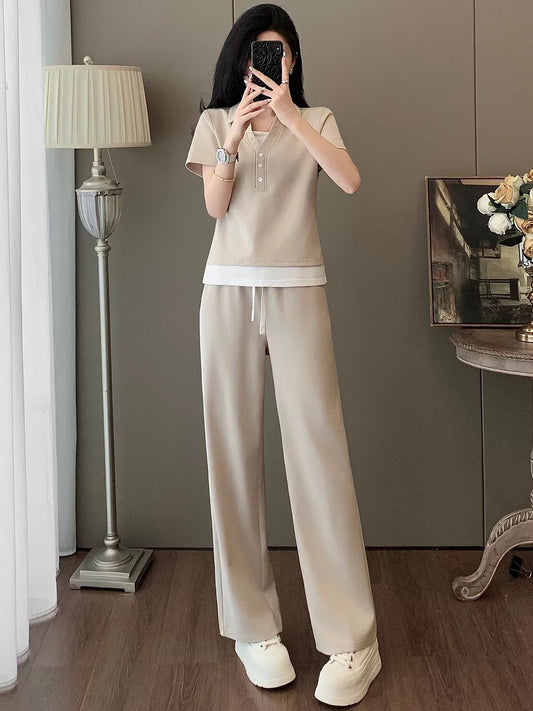 Ultra-chic European-style women's casual sportswear set for summer—a fashionable, youthful two-piece outfit featuring a "faux-layered" short-sleeve T-shirt and wide-leg trousers.