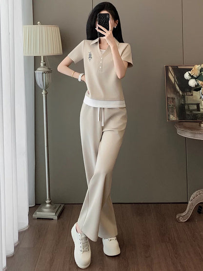 Ultra-chic European-style women's casual sportswear set for summer—a fashionable, youthful two-piece outfit featuring a "faux-layered" short-sleeve T-shirt and wide-leg trousers.