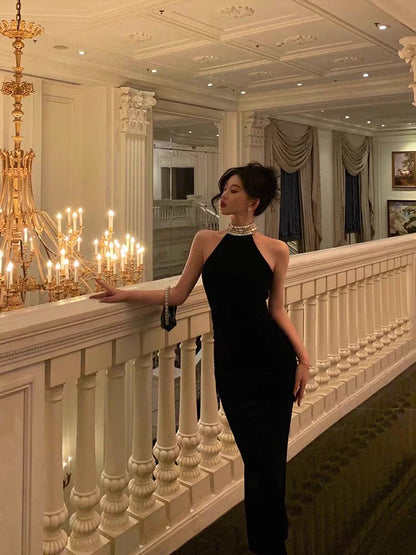 French-style black halter-neck dress (2026 new arrival): a rhinestone-embellished, waist-cinching, hip-hugging, mermaid-style long gown that blends innocent charm with a sexy allure.