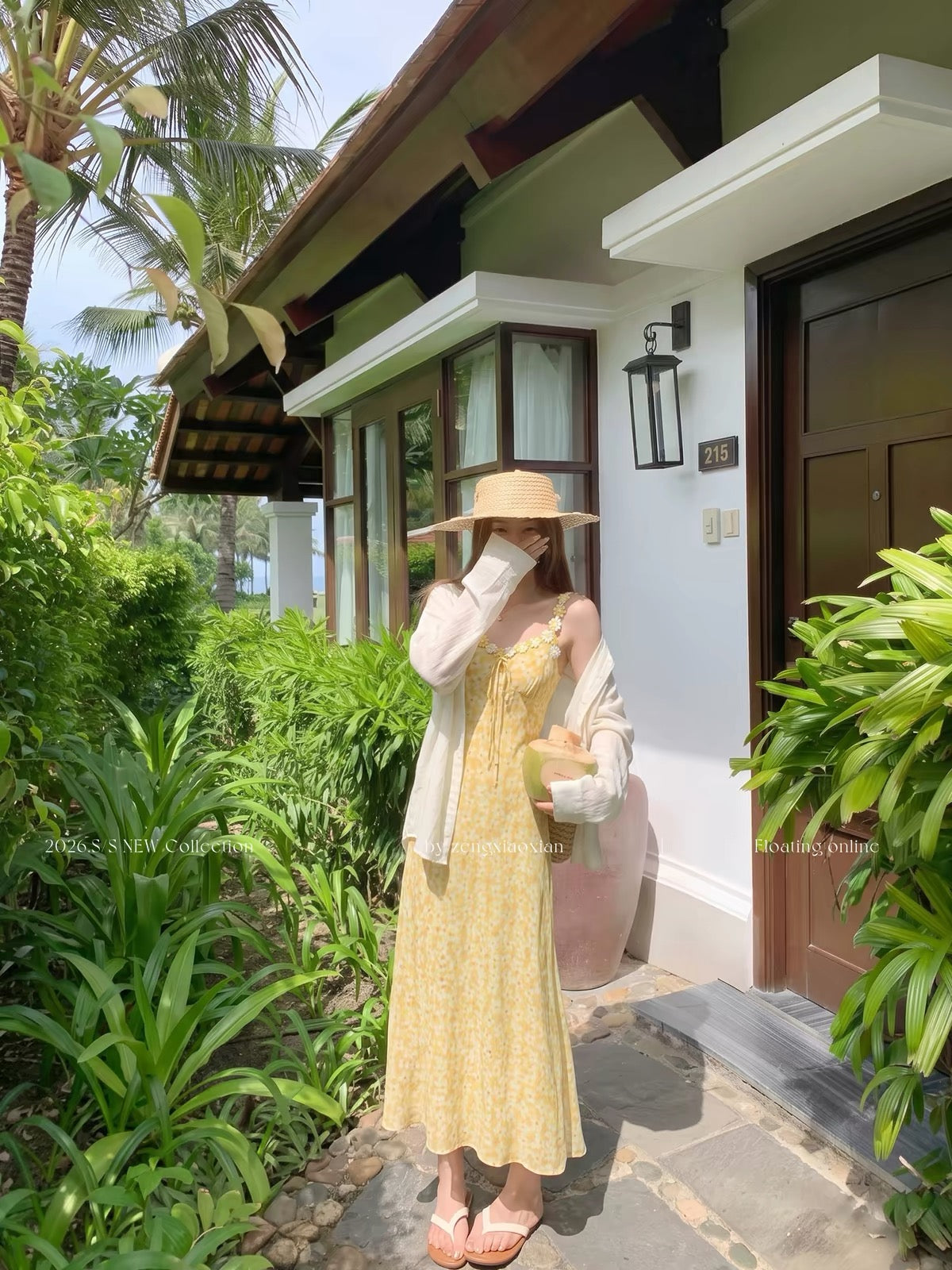 Zeng Xiaoxian yellow floral-print camisole maxi dress featuring a waist-cinching fit, 3D floral embellishments, and a vacation-ready, atmospheric style.