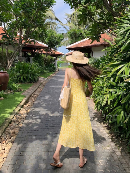 Zeng Xiaoxian yellow floral-print camisole maxi dress featuring a waist-cinching fit, 3D floral embellishments, and a vacation-ready, atmospheric style.