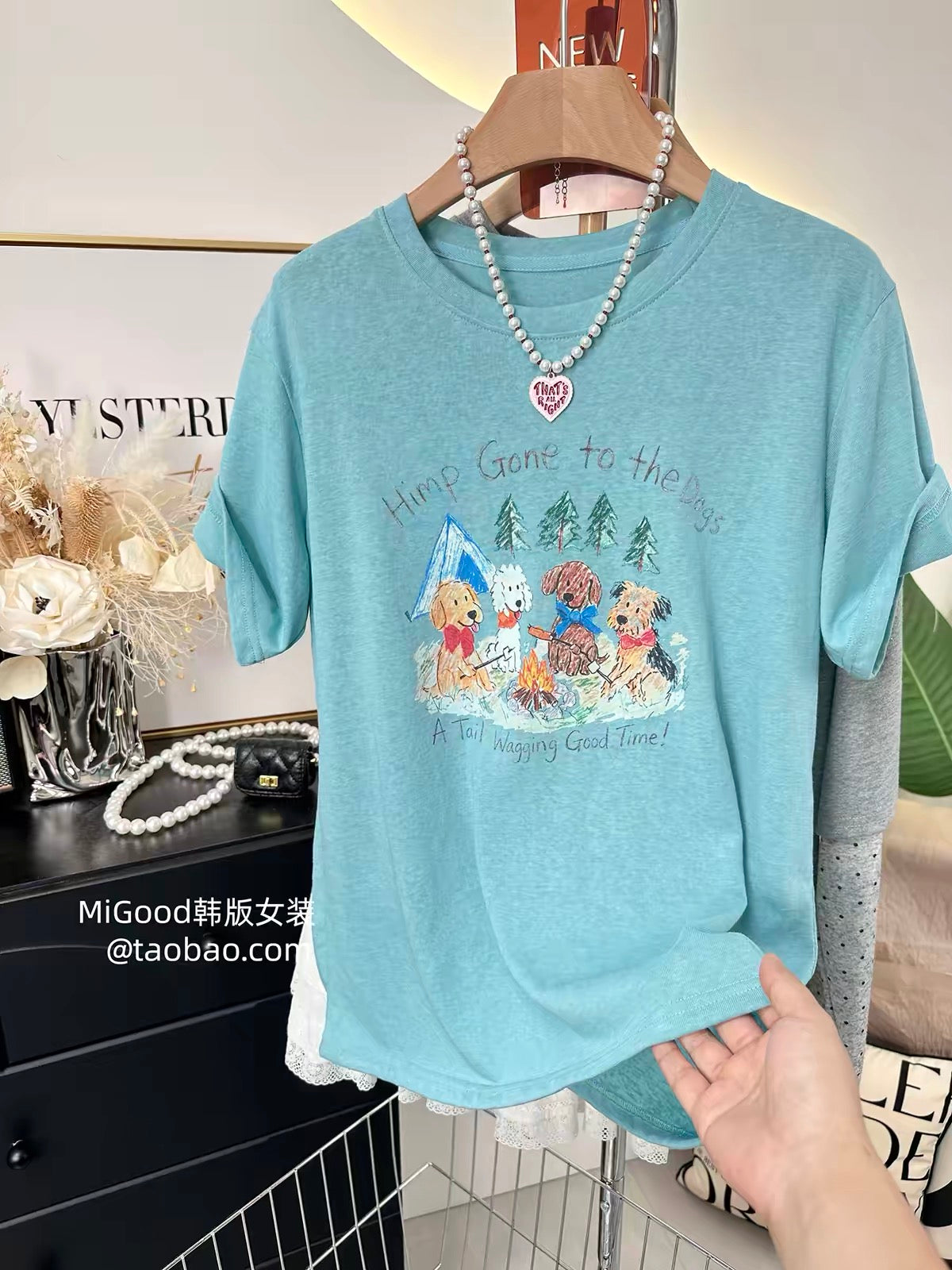 A personal favorite—stylish Korean-style loose-fit T-shirt for women. Features a cute illustrated puppy design and a flattering cut; made from lightweight "snow-wash" cotton.