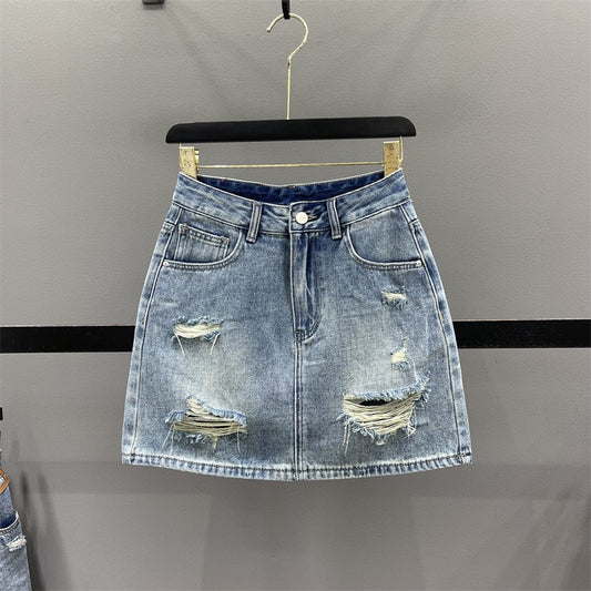 European ripped denim skirt female 2023 summer foreign style high waist slimming A-line anti-light package hip short skirt
