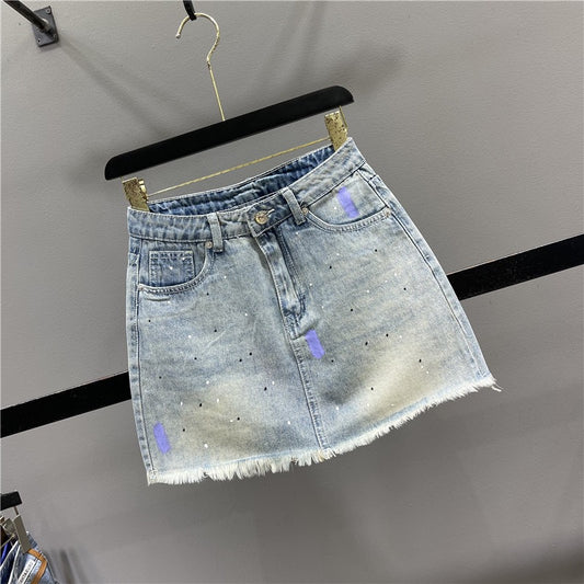 2023 summer new personality splashed ink spray paint denim skirt women's all-match slimming A-line raw edge bag hip skirt