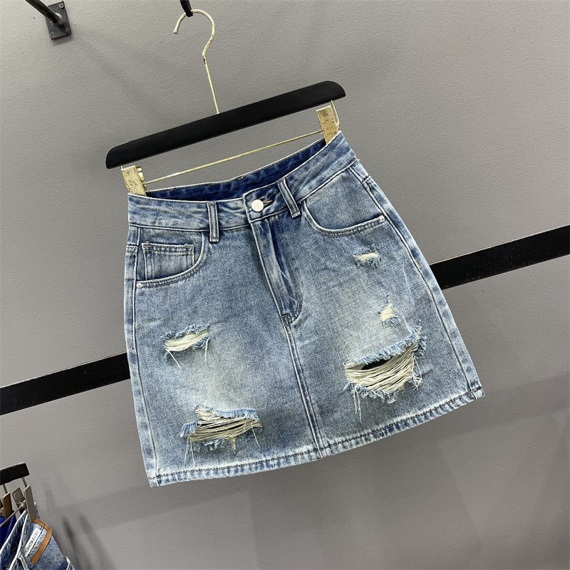 European ripped denim skirt female 2023 summer foreign style high waist slimming A-line anti-light package hip short skirt