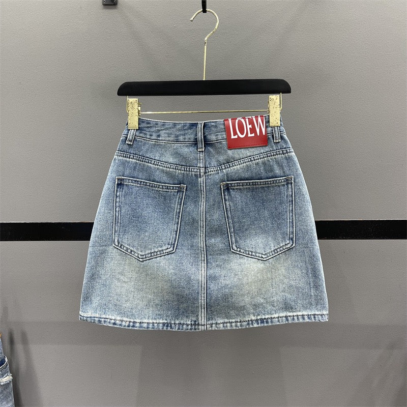 European ripped denim skirt female 2023 summer foreign style high waist slimming A-line anti-light package hip short skirt