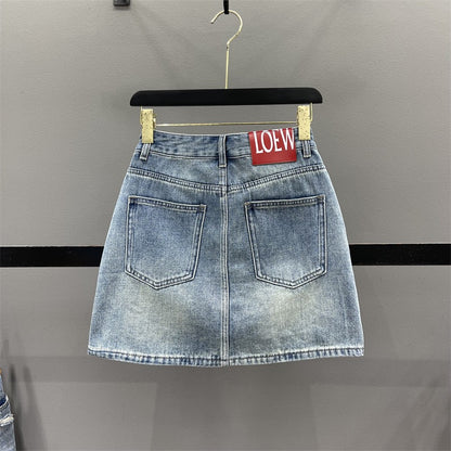 European ripped denim skirt female 2023 summer foreign style high waist slimming A-line anti-light package hip short skirt