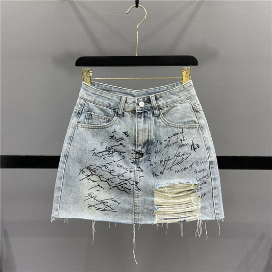 Letter graffiti ripped denim skirt female 2023 summer new high waist thin A word raw edge bag hip skirt