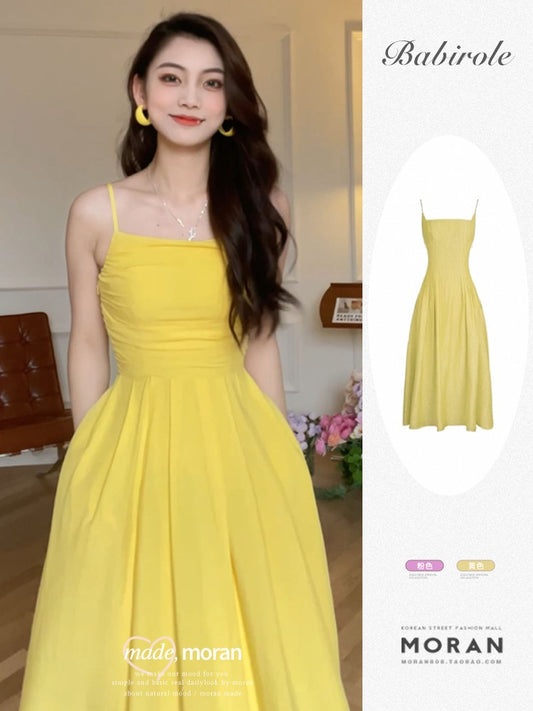 Tea break French suspender dress 2023 summer new seaside vacation waistline slim yellow a-line dress