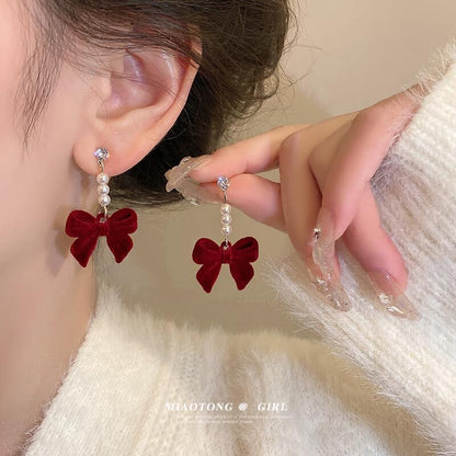Silver needle autumn and winter red velvet earrings female pearl bow earrings niche design high-end versatile earrings