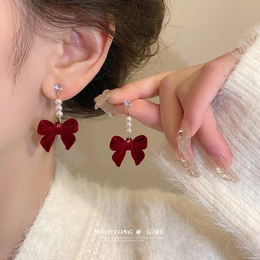 Silver needle autumn and winter red velvet earrings female pearl bow earrings niche design high-end versatile earrings