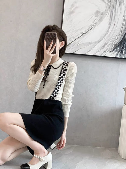 Autumn and winter high-end black knitted dress 2022 new women's French high-end fake two-piece small skirt