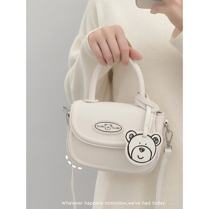 Bag women 2022 new style gentle wind bear decoration age-reducing girl crossbody bag all-match texture one-shoulder saddle bag