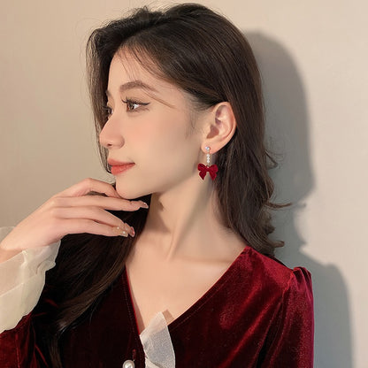 Silver needle autumn and winter red velvet earrings female pearl bow earrings niche design high-end versatile earrings