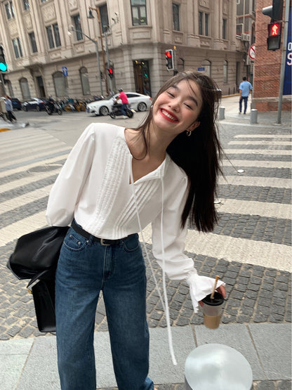 Pusumede white long-sleeved shirt female 2022 new trumpet sleeve top niche French chic lace-up shirt