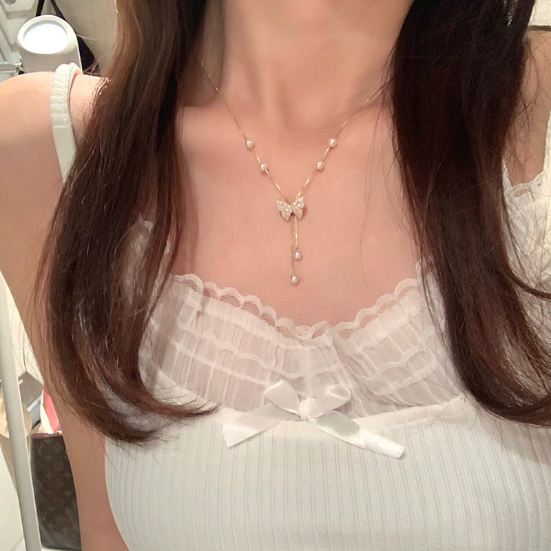 Pure desire butterfly pull pearl necklace women's spring light luxury niche high-end design sense necklace clavicle chain accessories