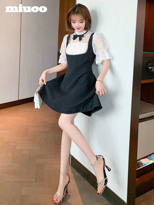 miuco contrast color stitching lace trumpet cuff nail drill high waist umbrella fake two-piece dress female 2022 Xia Xin
