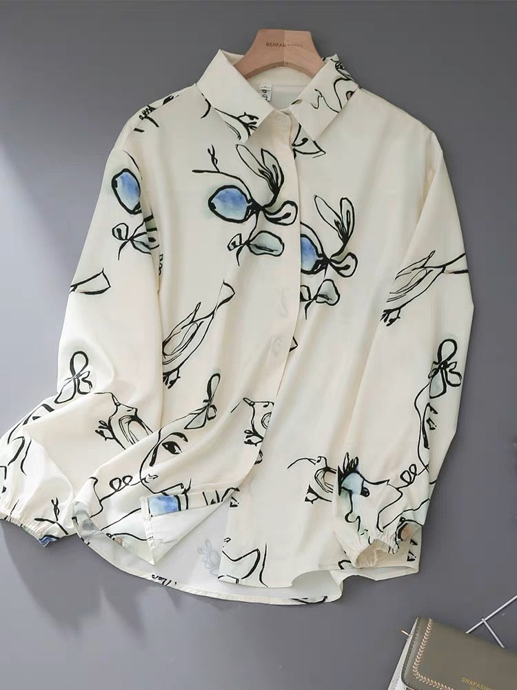 Niche design sense printed lapel shirt women 2023 spring women's temperament professional commuting lantern sleeve shirt