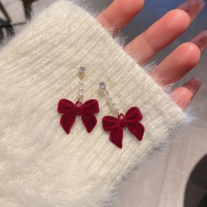 Silver needle autumn and winter red velvet earrings female pearl bow earrings niche design high-end versatile earrings