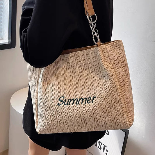Summer straw woven large-capacity bag women's 2022 new niche wild woven bag Western style commuter shoulder tote bag