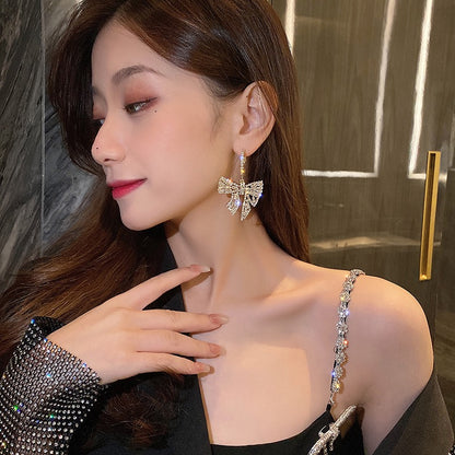 Super fairy earrings high-end sense light luxury 2021 new trendy small earrings exquisite bow earrings exaggerated earrings