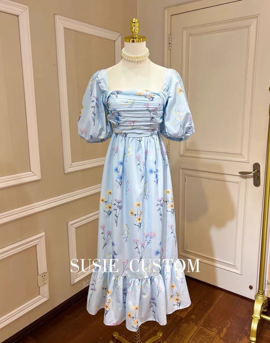 High-definition big puff sleeves, one-word collar, off-the-shoulder wear, pleated tube top, slim A-line skirt, ruffled printed long skirt